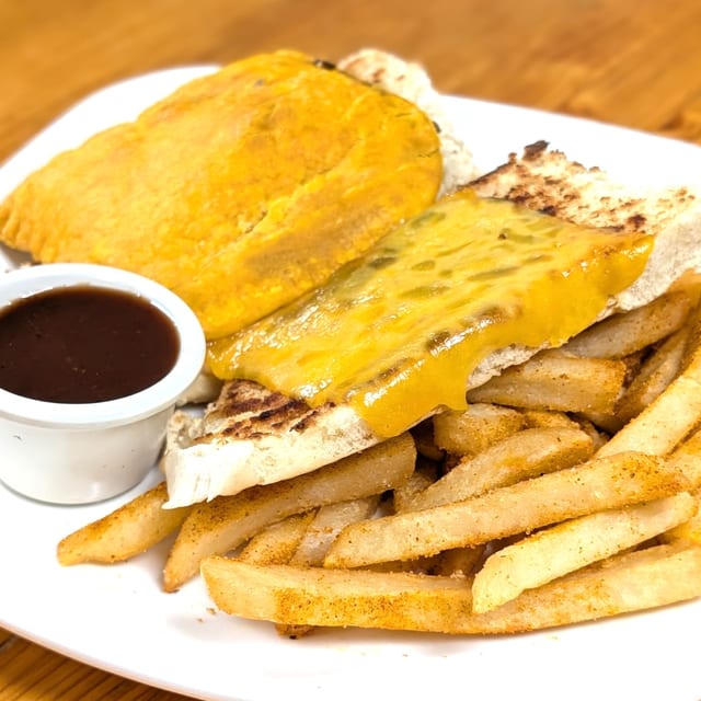 Jamaican beef patty coco bread sandwich.