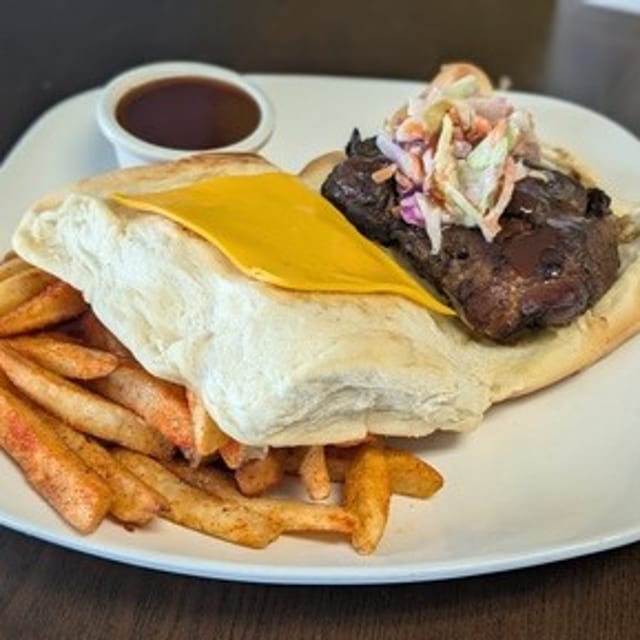 Jerk chicken coco bread sandwich.
