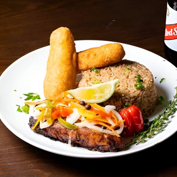 Jamaican escovitch fish with rice and peas, fried dumplings, and pickled vegetables.